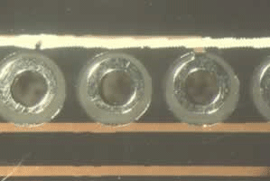 Figure 3: Exposed tracks due to over-size resist aperture